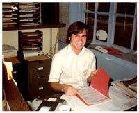 Chuck Trautman at 16, preparing returns at a desk in the Champaign office
